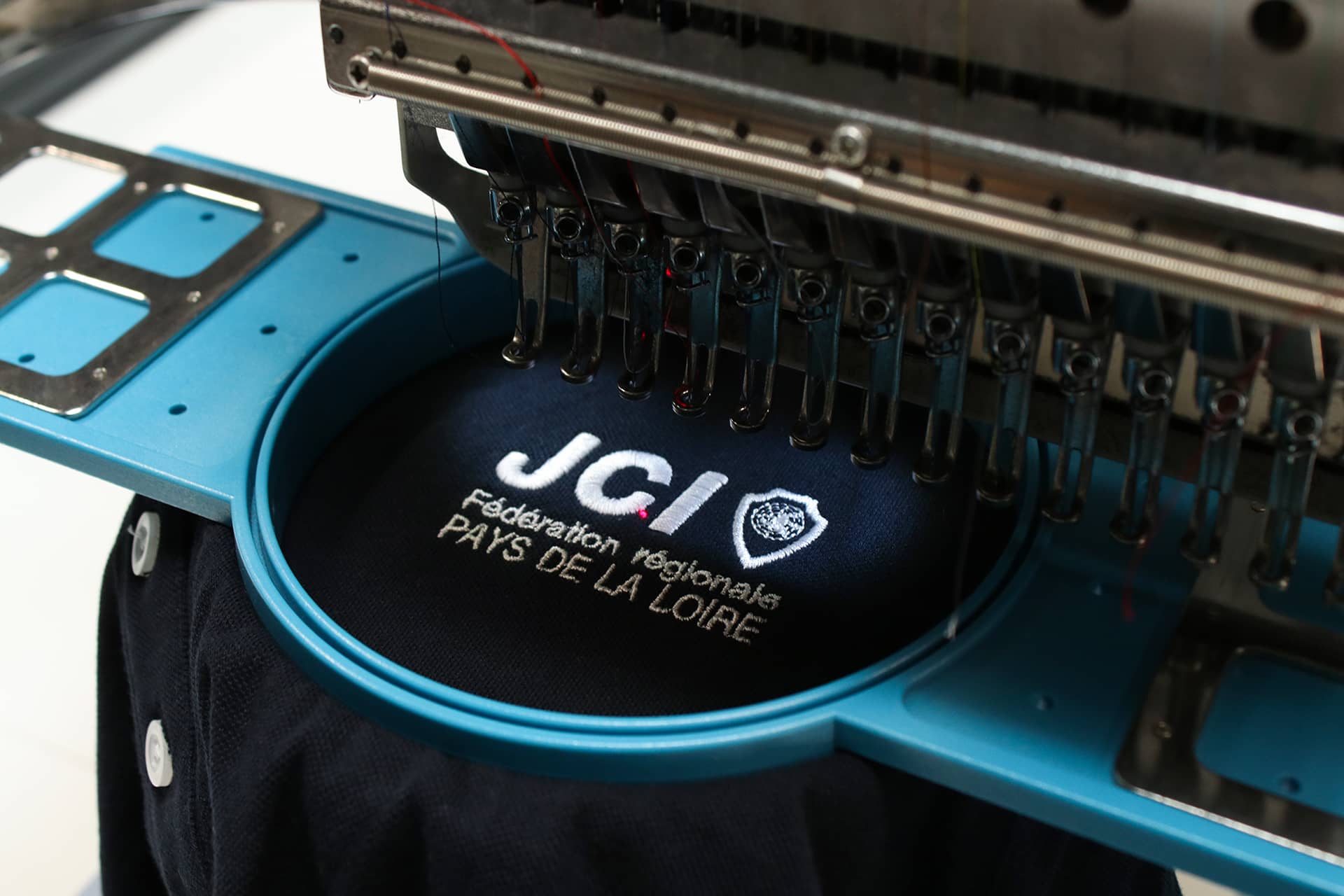 Broderie JCI par Largeot & Coltin